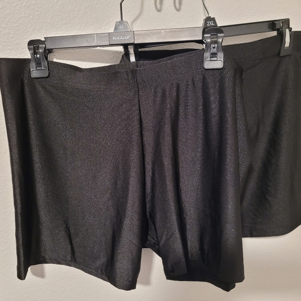 Two pairs of shiny loose biker shorts